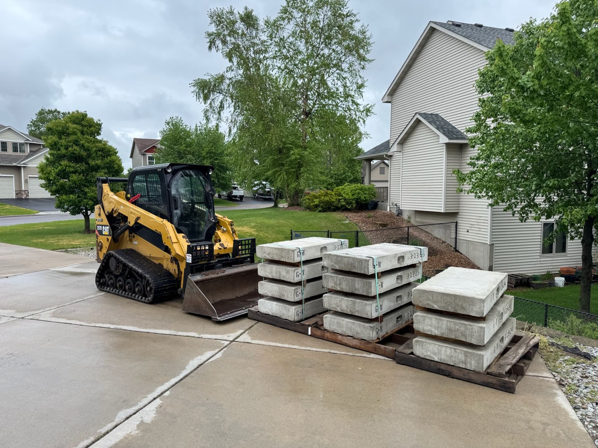 Paver Pathway and Staircase Built Down a Sloped Backyard