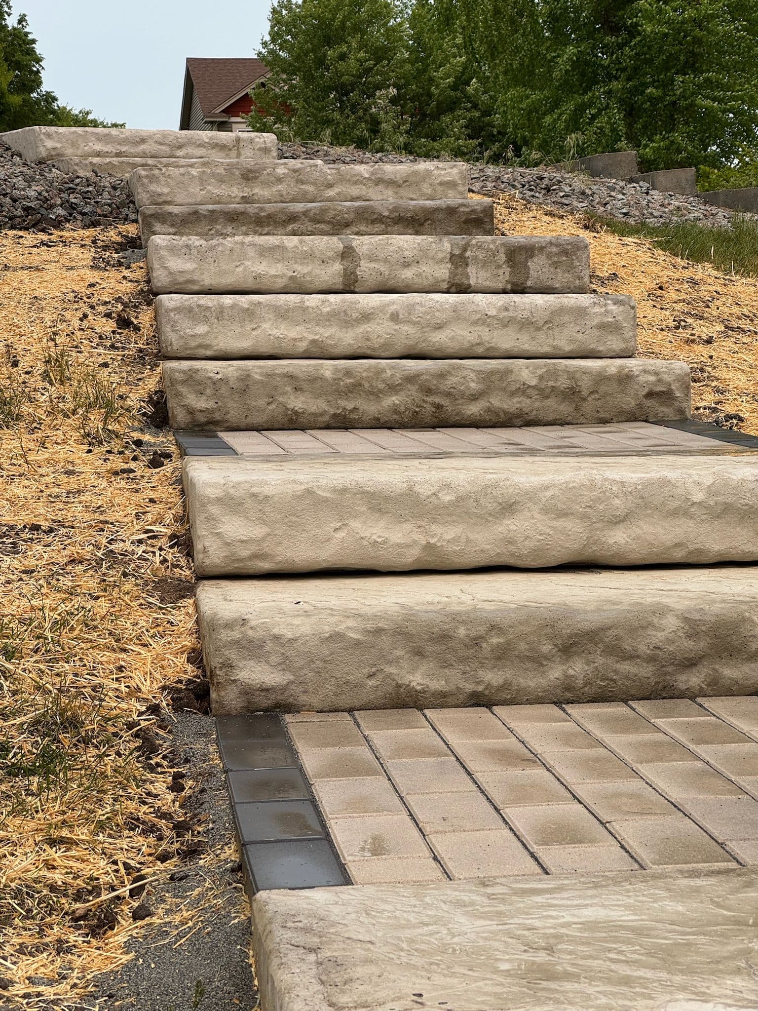 Paver Pathway and Staircase Built Down a Sloped Backyard