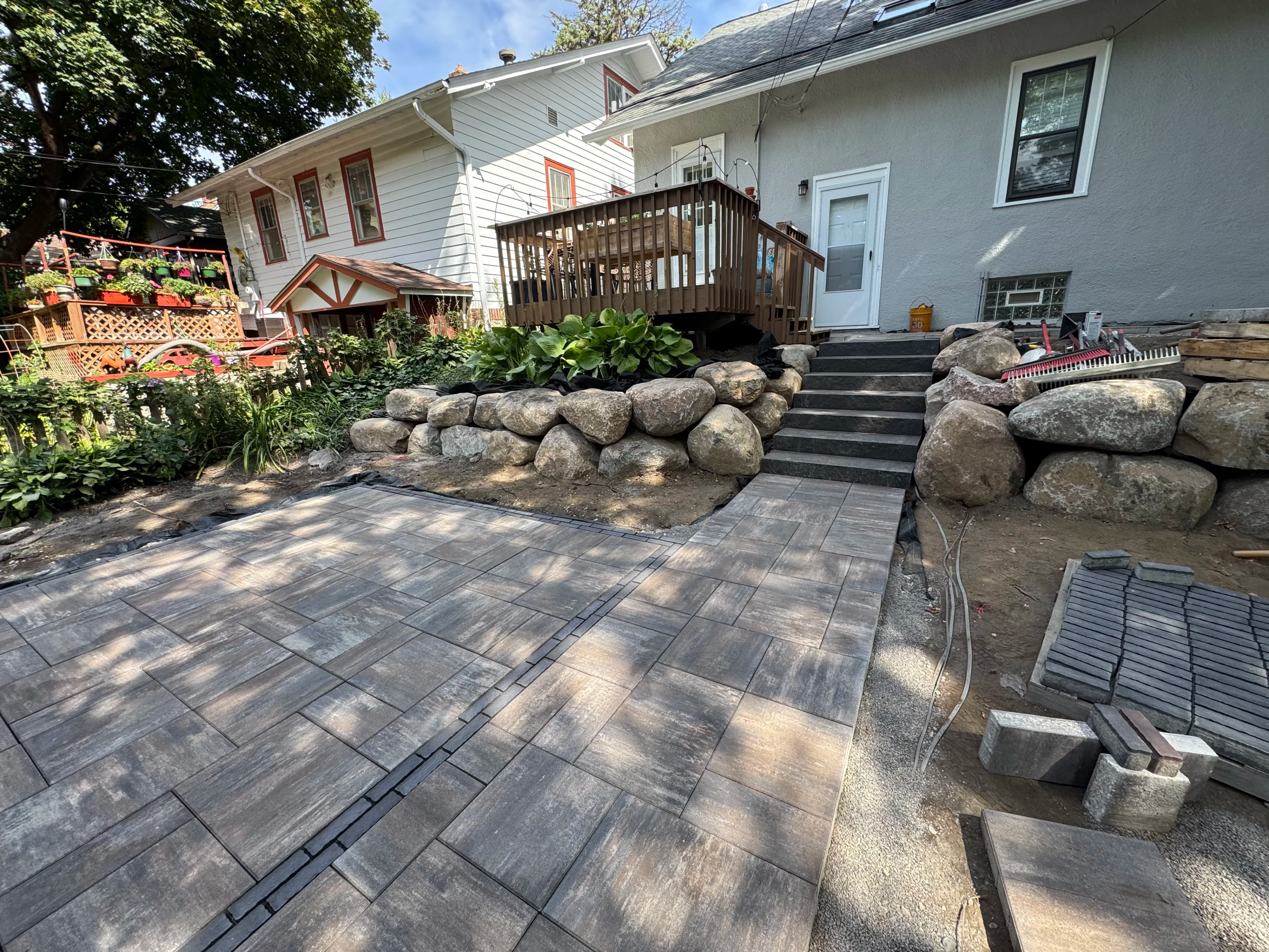 Project Paver Patios, Boulder Walls, and Full Excavation - Nearly There image