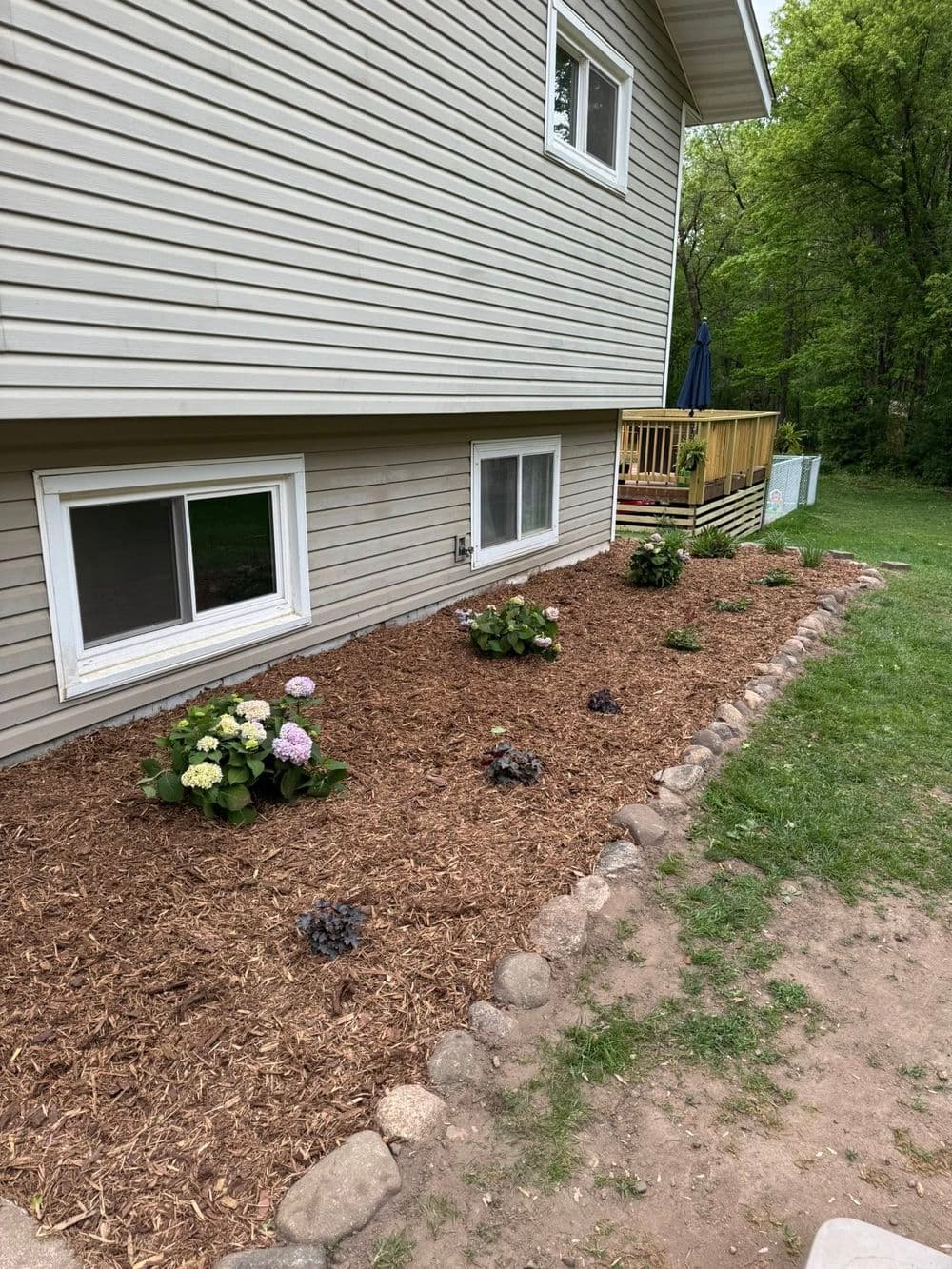 Transforming Outdoor Spaces in Roseville MN with Mulch and Boulder Edging image